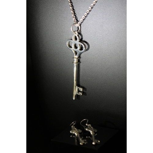 196 - WARREN JAMES BOX CONTAINING SILVER - 925 NECKLACE WITH KEY PENDANT & MATCHING SILVER 925 EARINGS... 