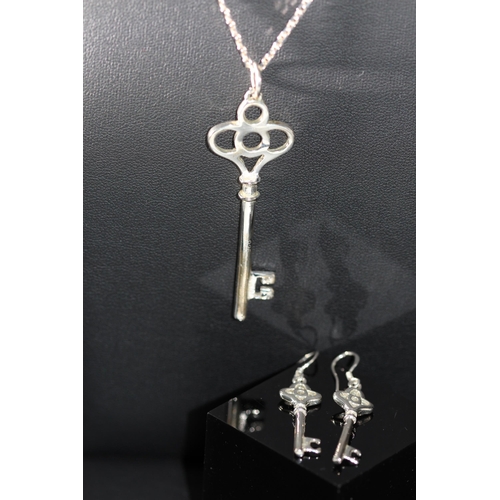 196 - WARREN JAMES BOX CONTAINING SILVER - 925 NECKLACE WITH KEY PENDANT & MATCHING SILVER 925 EARINGS... 