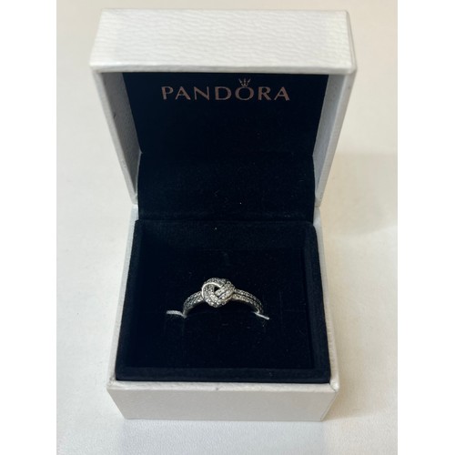 139 - PANDORA LOVE KNOT SILVER RING WITH CLEAR CUBIC ZIRONIA IN BOX RRP £59(P19226417/A)