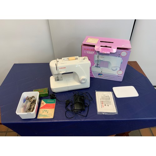 69 - SINGER 1507 SEWING MACHINE RRP £125 & TABLE PLUS ACCESSORIES, NEEDLES ETC