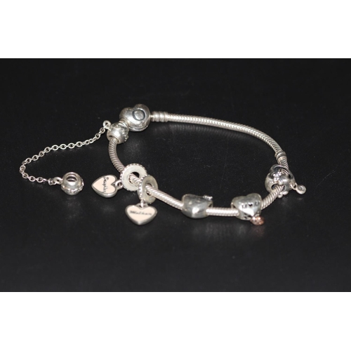 218 - PANDORA BRACELET WITH 6 CHAMS (P22209886/F)