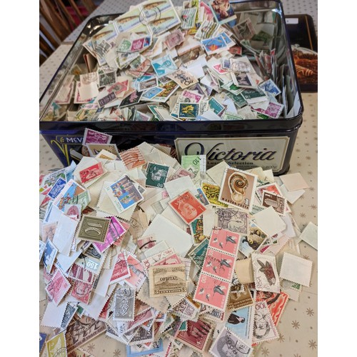 3 - Collections; biscuit tin well-filled with c.500g of world off-paper stamps, little or no UK seen. (1... 