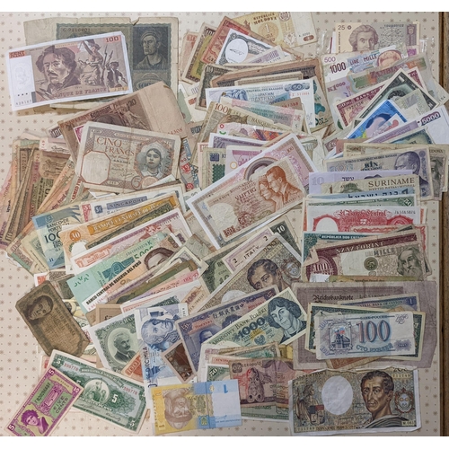 40 - Banknotes; a very mixed bundle of foreign (i.e. non-UK) notes from a wide variety of countries. Mixe... 