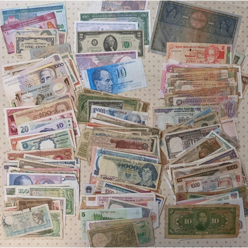 41 - Banknotes; a very mixed bundle of foreign (i.e. non-UK) notes from a wide variety of countries. Mixe... 
