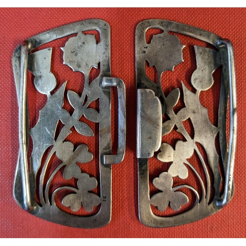 63 - Silverware; pair of late Victorian sterling silver belt buckles, with thistle/shamrock/rose design. ... 