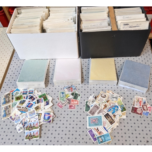 1005 - Mixed Lots; two small boxes with many hundreds of world stamps sorted into packets.