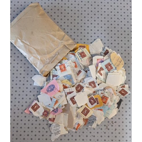 2715 - UK Security Overprints; a packet of KG6 and QE stamps on piece, all off receipts, and including a sc... 