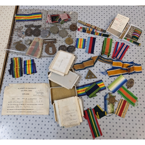 48 - Medals; old biscuit tin with an accumulation including WW1British War Medal (12), Victory (20), 1914... 