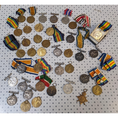 48 - Medals; old biscuit tin with an accumulation including WW1British War Medal (12), Victory (20), 1914... 