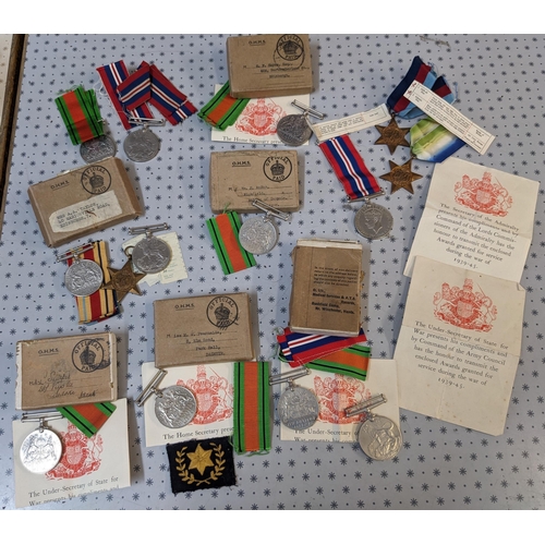 48 - Medals; old biscuit tin with an accumulation including WW1British War Medal (12), Victory (20), 1914... 