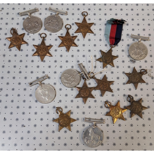 48 - Medals; old biscuit tin with an accumulation including WW1British War Medal (12), Victory (20), 1914... 