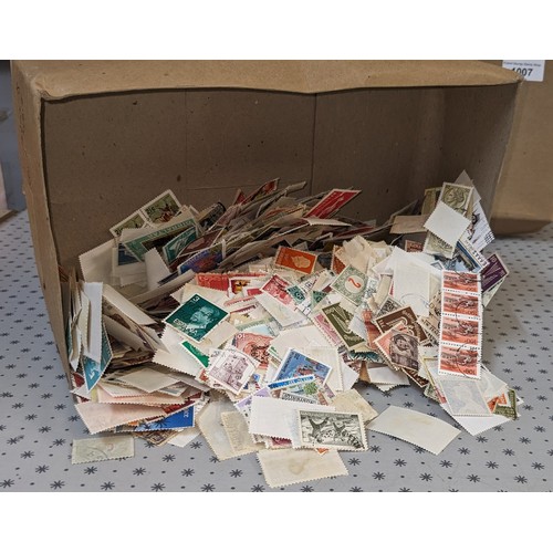 1007 - Mixed Lots; small box with about 120g net weight of loose world (non-UK) stamps. (1,000s)... 