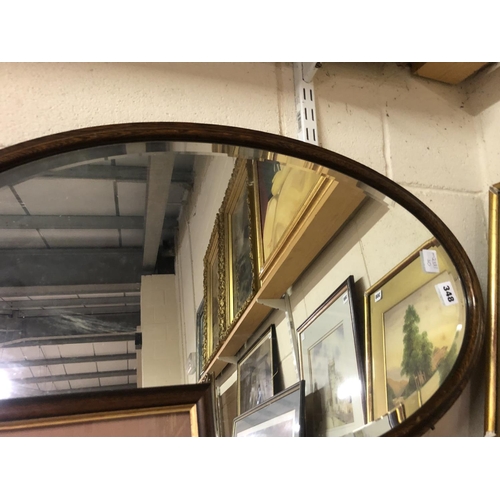 348 - BEVELLED OVAL WOOD FRAMED MIRROR