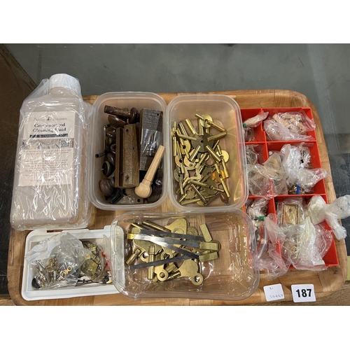 187 - VARIETY OF CLOCK PARTS INC BRASS KEYS, CLEANING FLUID ETC