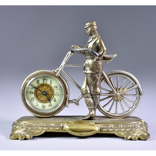 125 - A Novelty American Silvered and Brass Desk Timepiece, in the form of a gentleman standing by a bicyc... 