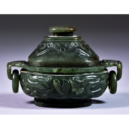 17 - A Chinese Dark Green Jade Two-handled Koro and Cover, carved with stylised leaf scrolls, and with ri... 