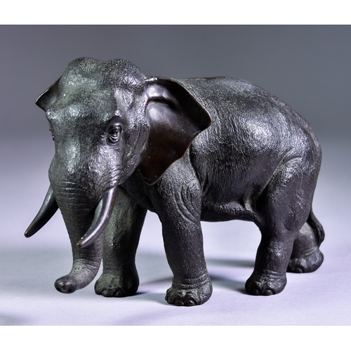 18 - A Japanese Bronze Model of an Elephant, 8ins (20.32cm) overall x 6ins (15.24cm) high, with maker's s... 