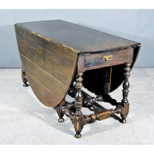 255 - A Late 17th Century Oak Oval Gateleg Table, of large proportions, with plain top, shaped apron, fitt... 