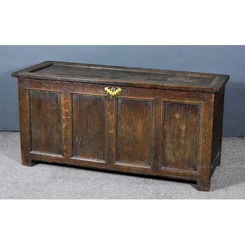 256 - A 17th Century Panelled Oak Coffer, with single panelled lid and four panelled front, 51ins wide x 2... 