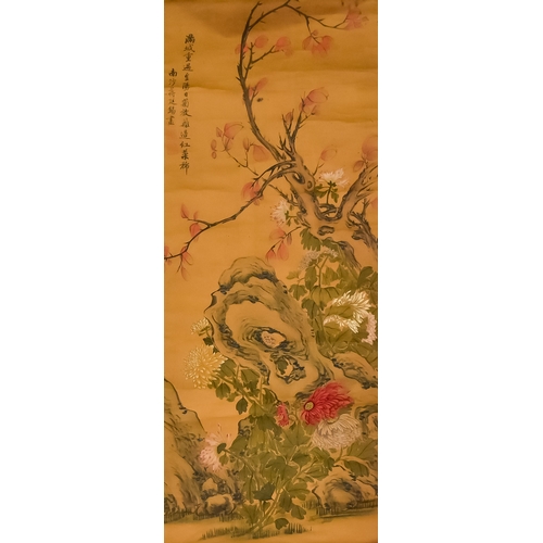 26 - A Chinese Silk Scroll Painting, depicting flowering branches and rockwork, with a silk border, two l... 