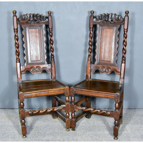 260 - A Pair of 17th Century Oak High Back Dining Chairs, with scroll carved crests, a fielded panel splat... 