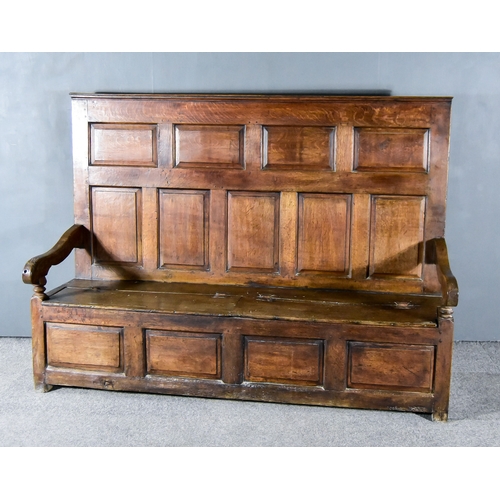 265 - A 17th Century Panelled Oak Hall Settle, with moulded crest rail, nine fielded panels to back, outsc... 