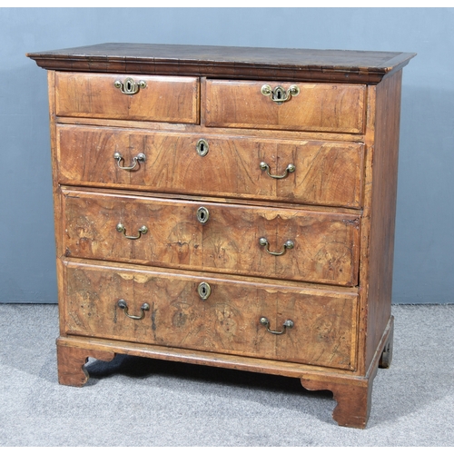 275 - An 18th Century Walnut and Pine Sided Chest, pine top with moulded edge, the front inlaid with cross... 