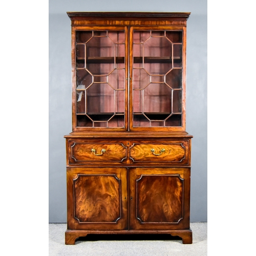 284 - A George III Mahogany Secretaire Bookcase, the upper part with dentil moulded cornice, fitted two sh... 