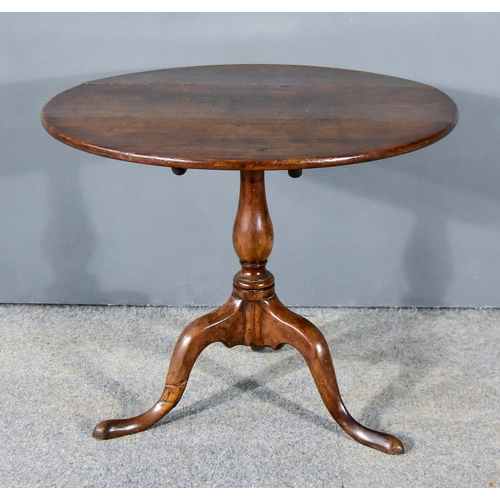 285 - A George III Mahogany Tripod Occasional Table, with plain top, on baluster turned central column and... 