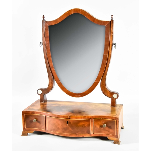 286 - A George III Figured Mahogany Shield-Pattern Toilet Mirror, with cross banded frame, inset with beve... 