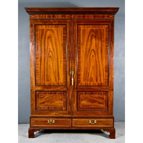 290 - A George III Gentleman's Figured Mahogany Wardrobe, with moulded dentil cornice and inlaid with stri... 