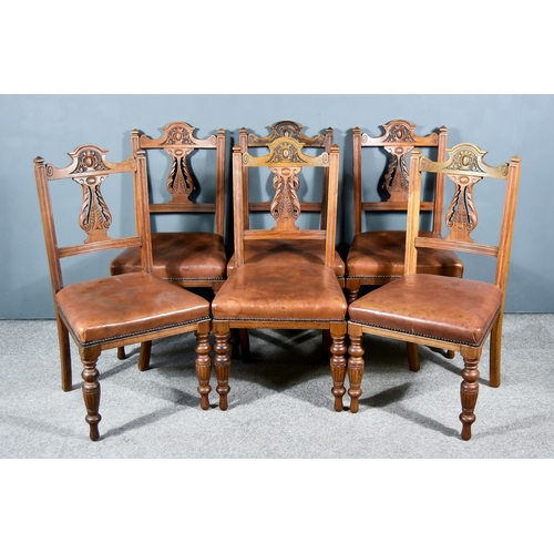 311 - A Set of Six Victorian Oak Dining Chairs, each with shaped and carved crest rails, leaf scroll carve... 