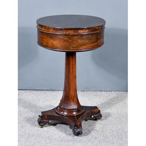 312 - An Early Victorian Rosewood Circular Teapoy, with square edge to top, plain frieze, the pop-up mecha... 