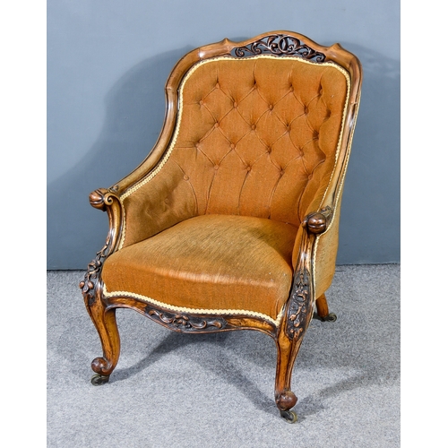 313 - A Victorian Mahogany Framed Tub Shaped Armchair, the moulded frame with scroll carved and leaf ornam... 