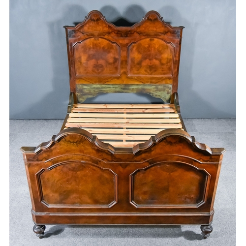 322 - A 19th Century French Figured Walnut 4ft 6ins Bedstead, with twin arched and moulded panels to head ... 