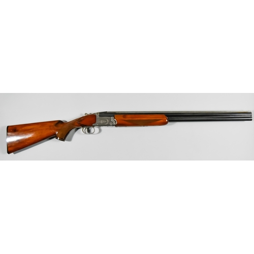 53 - A 12 Bore Over and Under Shotgun by Shadow, 27.5ins blue steeled barrels with raised top rib, bright... 