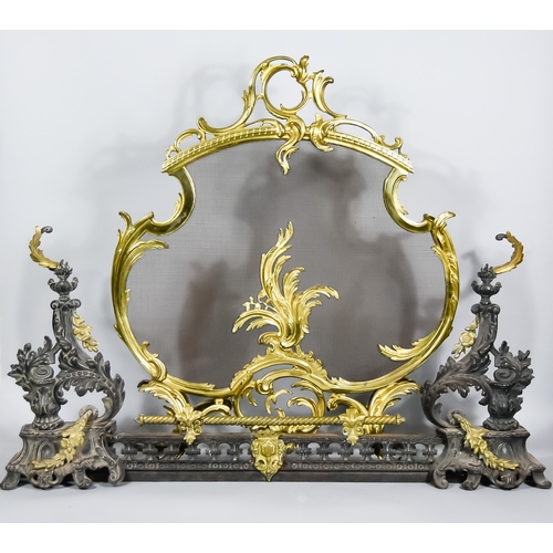 852 - A Brass Fireguard of Rococo Design and a Fender with Chenets,Â the fireguard of cartouche shape and ... 