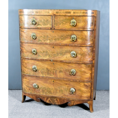 892 - A George IV Mahogany Bow Front Chest, the square top edge inlaid with rosewood and satinwood panels,... 