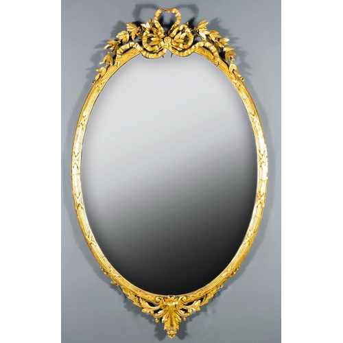 893 - A 19th Century French Gilt Framed Oval Wall Mirror of Large Proportions,Â in reeded frame with bold ... 