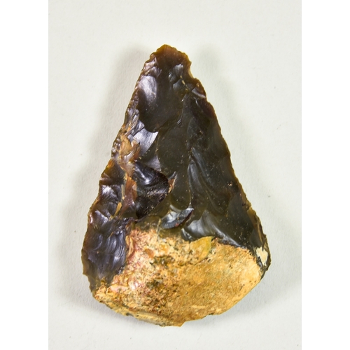 307 - An Acheulean Knapped Handaxe, Lower Palaeolithic c. 410,000 BP, of Wymer type E form, in brown flint... 