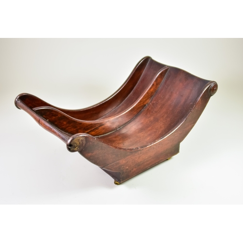 271 - A George III Mahogany Cheese Boat of Scroll Form, on rectangular base with castors, 17ins wide x 10i... 