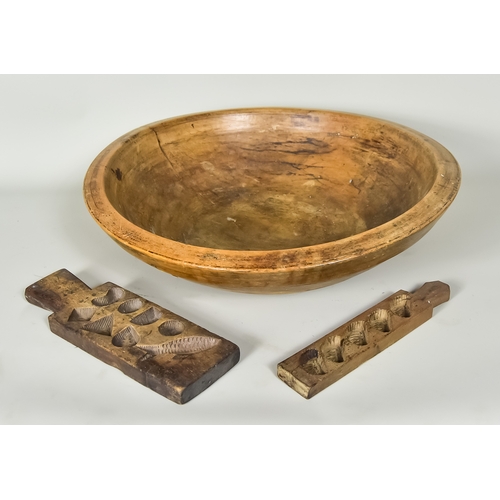 272 - A Turned Sycamore Bowl and Two Carved Butter Moulds, the moulds in shaped of various fruits, shapes ... 