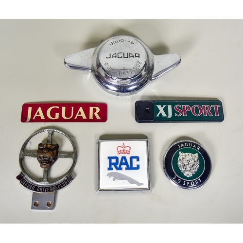 297 - A Small Quantity of Jaguar Badges and Accessories, including - ten boot badges from the XJ series, a... 