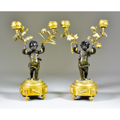 313 - A Pair of 19th Century Continental Brown Patinated Bronze and Ormolu Figural Twin Light Candelabra, ... 