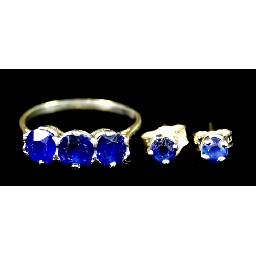 597 - A White Metal Ring set with three faceted sapphire stones of approximately 1ct total, with matching ... 