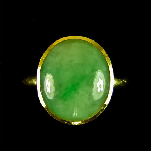 602 - An 18ct Gold Cabochon Jadite Ring, set with a solitaire cabochon jadite stone of approximately 16mm ... 