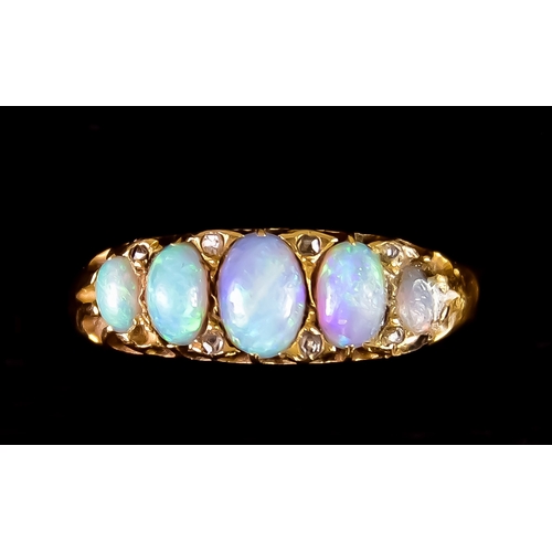 603 - An 18ct Gold Five Stone Opal Ring, set with five cabochon opal stones, size O, gross weight 3.4g