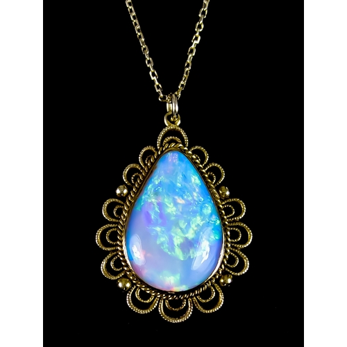 604 - A Large Tear Drop Opal Pendant, set in yellow metal pendant mount, with gold back, 43mm x 30mm, tota... 