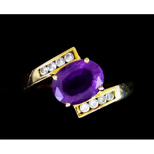 605 - A 14ct Gold Amethyst and Diamond Ring, set with a faceted amethyst stone of approximately 1.25ct, fl... 