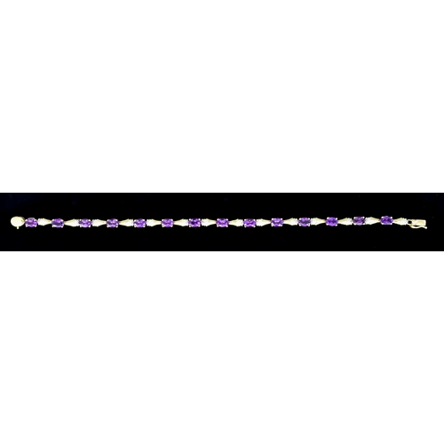 608 - A 9ct Gold Amethyst and Diamond Bracelet set with fourteen faceted amethyst stones interspaced by sm... 